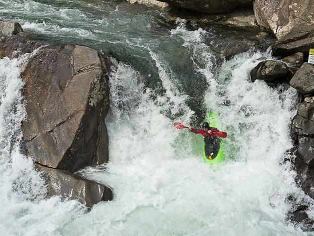 Kayaker goes over the Waterfall